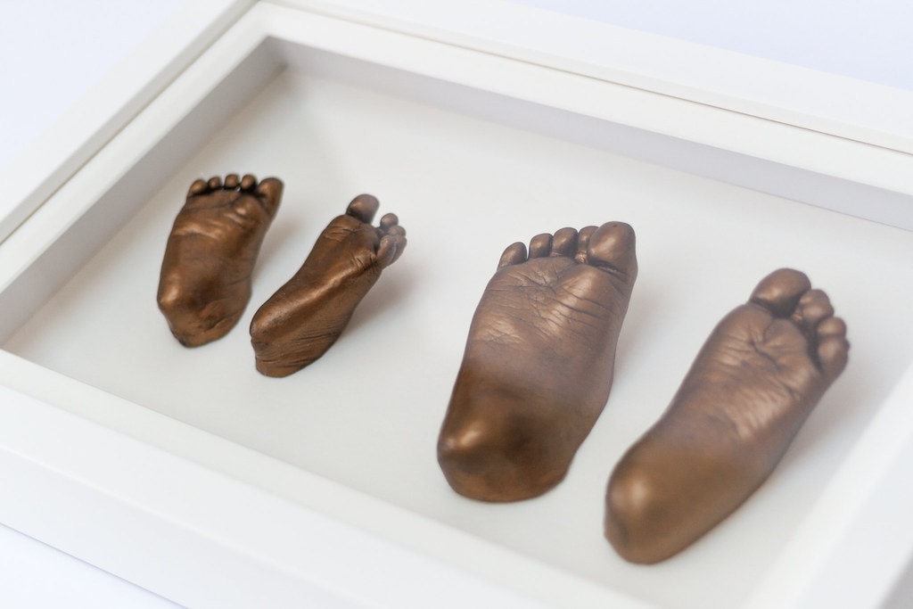 Gold baby hand and foot casting in elegant frame