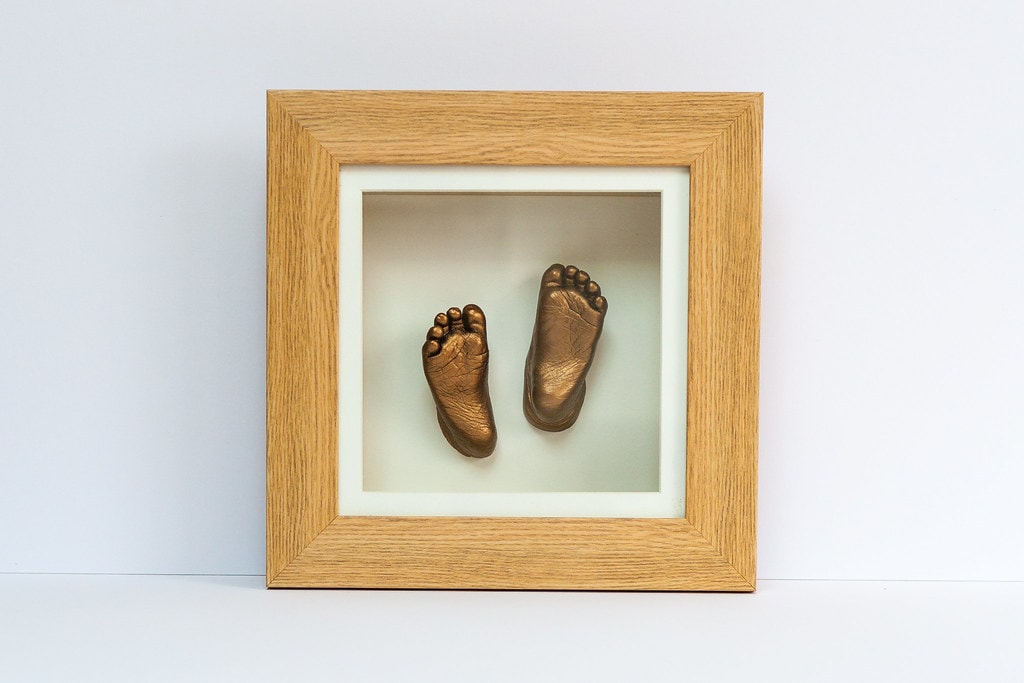 Bronze baby hand and foot casting in elegant frame